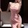 Woman in pink lace sleep dress with high slit, posing indoors. sheer sexy slip dress for sensual lounge wear.