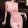 Woman in a pink sheer slip dress with high slit, featuring lace details and a sensual design for loungewear.