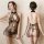 Sheer black lace cheongsam lingerie set with halter neck, floral embroidery, and open back design for women.