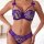 Woman wearing purple sheer lace bra set with underwire, featuring delicate floral patterns and bow accents on straps.