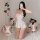 Woman modeling white sheer babydoll nightgown with backless design, featuring silk-look lace and flared skirt.