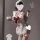 Woman in white plus size maid-inspired lingerie set with red bow, holding milk glass. pure & alluring kawaii sleepwear.