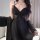 Woman wearing black butterfly lace sleep dress with satin slip nightgown, pure-aesthetic lounge wear for sexy elegance.
