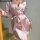 Soft pink satin sleep dress with tie belt, elegant design perfect for summer lounging.