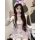 Woman wearing pure & playful bunny girl lingerie set – sexy cute sleepwear with purple bows, ears, and lace trim.