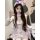A woman wearing a cute bunny-themed lingerie set, featuring pastel colors and playful details, perfect for sleepwear or casua...