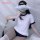 A woman poses with a cloud-like accessory over her face, wearing a white and navy college girl-themed bikini set featuring a ...