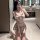 Woman in pink plaid jk sleepwear set with bow top and skirt, posing in bathroom mirror for sexy student roleplay lingerie loo...