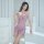 Woman modeling purple lace chemise sleepwear with heart details and bodycon fit in bright minimalist room.