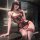 Woman wearing black lace bodysuit with red bows and pearls, sheer stockings, blindfold – pure & playful lingerie set.