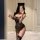 Woman wearing pure & playful leopard print lingerie set with cat ears, posing in mirror selfie for couples play.