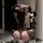 Woman in black sheer mesh lingerie set with bunny ears, posing by mirror. pure & playful lingerie set for romantic nights.