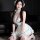 A woman poses in a cute maid costume from the pure & playful lingerie set, featuring sheer fabric and lace details for modest...