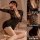 Woman in black lace lingerie set with deep v-neck and bodycon skirt, posing seductively on bed — pure & playful secretary-ins...