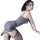 Woman modeling gray pure & playful lingerie set, seductive secretary-style sleepwear with thigh-highs, posed romantically.