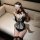 Woman wearing pure & playful lingerie set – black and white lace bodysuit with bow, blindfold, and thigh-highs for seductive ...