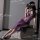 Woman in purple sheer lingerie set, sitting on stool, showcasing pure & playful lingerie set - seductive sheer sleepwear.