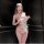 Woman in pure & playful lingerie set, sheer belly dance top with open-crotch chef-style design.