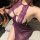 Woman wearing purple lace lingerie set with sheer open-crotch skirt, showcasing elegant and seductive design for intimate mom...