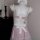 Pink lingerie set with white bow and lace trim, featuring a playful yet elegant design for seductive sleepwear.