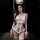 Woman wearing white lace lingerie set with bow details, fishnet stockings, and choker - pure & playful qinyu-inspired chemise...