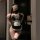 Woman wearing pure & playful lingerie set - sexy maid costume outfit with seductive sleepwear dress for women, posing blindfo...