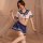 Model wearing pure & playful lingerie set: sexy student-style uniform sleepwear with navy sailor top, pleated skirt, and lace...