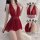 Woman wearing a red lace sleep dress with a deep v-neck and sheer fabric, showcasing the pure & playful lingerie sleepwear se...