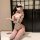 Woman in white pure & playful lingerie set with ruffles, bows, cat ears, and thigh-highs — sensual, elegant bedroom wear.