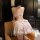 Woman wearing pure & playful maid outfit - polka dot floral sweet chef costume with adjustable ties, no-remove design.