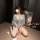 Woman wearing sheer floral kimono-style lingerie set, kneeling on floor with mirror reflection. pure & playful sensual linger...