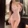 Woman wearing pink sheer mesh bodycon chemise with lace trim, form-fitting sleepwear for small bust, no-remove design.