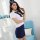 A woman models a pure & seductive air hostess costume set, featuring a white blouse with a navy blue tie and matching bodycon...