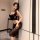 Woman wearing a sheer black lace bodysuit dress, posing indoors with elegant lighting. pure & seductive lingerie set for wome...