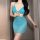 Woman wearing turquoise lace bodysuit dress with french-style cutout wrap design and neck tie.