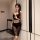 Woman wearing black sheer lace bodysuit dress, elegant lingerie set with transparent skirt and crop top, stylish sleepwear ou...