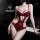 Woman in burgundy lace lingerie set, sheer plus size intimate outfit with strappy design.