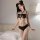 Woman modeling black pure & seductive lace lingerie set with push-up bra and matching panty, designed for small busts.