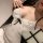 Woman wearing white polka-dot lace lingerie set with black ribbon detail – sheer, sexy, insertable outerwear style.