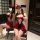 Woman wearing red and black pure & seductive lingerie set with devil horns, posing seductively in naughty qqny style erotic o...