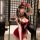 Woman in red and black pure & seductive lingerie set with devil horns, posing seductively in bathroom mirror selfie.