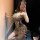 Woman posing in a mirror wearing a luxury leopard print lingerie set, showcasing the pure & seductive collections sensual des...