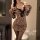 Woman wearing a leopard print lingerie set with a wrap skirt and lace details, exuding a blend of modesty and allure.