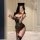 Woman wearing leopard print lingerie set with cat ears, featuring a seductive cosplay design for intimate wear.