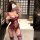 A woman poses in a luxurious bathroom wearing a purple lace lingerie set, featuring garter straps and stockings, perfect for ...