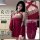 Model wearing red hanfu-style lingerie set with floral trim, open-crotch design, and crisscross straps for cosplay or sleepwe...