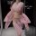 Woman wearing pink glittery pure & seductive lingerie set with gold chain accents and flowing sheer robe.
