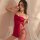 A woman poses in a red sheer lingerie set, featuring a strapless design with lace detailing, perfect for playful sleepwear or...