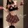 Woman wearing red plaid pure & seductive lingerie set with bow top, mini skirt, and thigh-highs in sexy qqny jk style.