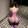 Woman wearing purple sheer mesh lingerie set with intricate lace detailing, perfect for date night romance and intimate momen...